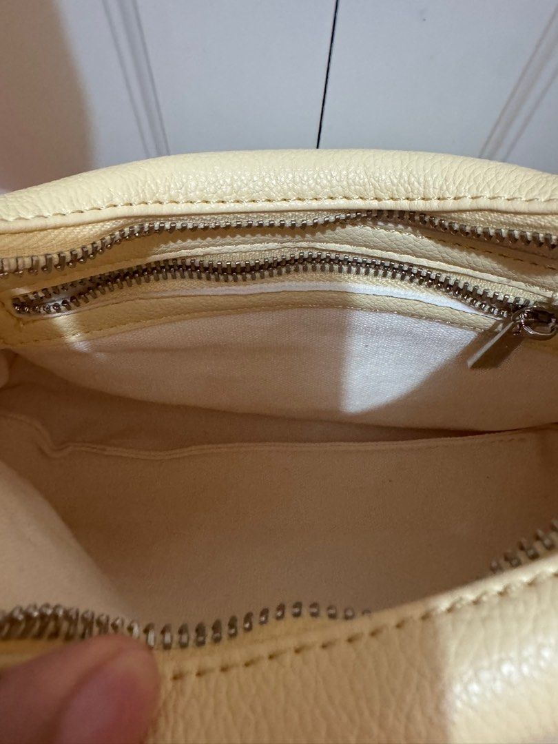 Aztrid Small Hobo bag (Category: Shoulder Bags) located in Tagaytay City. Submitted by leylamm (Listing ID 1410544783, Image 3). Description: Yellow (Buttermilk). Bought for the year-end party, used once only. No major issue. Selling to support my rescued cats..