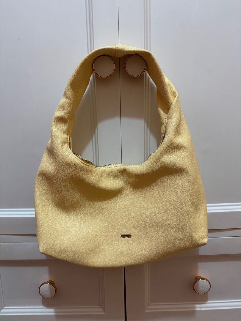 Aztrid Small Hobo bag (Category: Shoulder Bags) located in Tagaytay City. Submitted by leylamm (Listing ID 1410544783, Image 1). Description: Yellow (Buttermilk). Bought for the year-end party, used once only. No major issue. Selling to support my rescued cats..