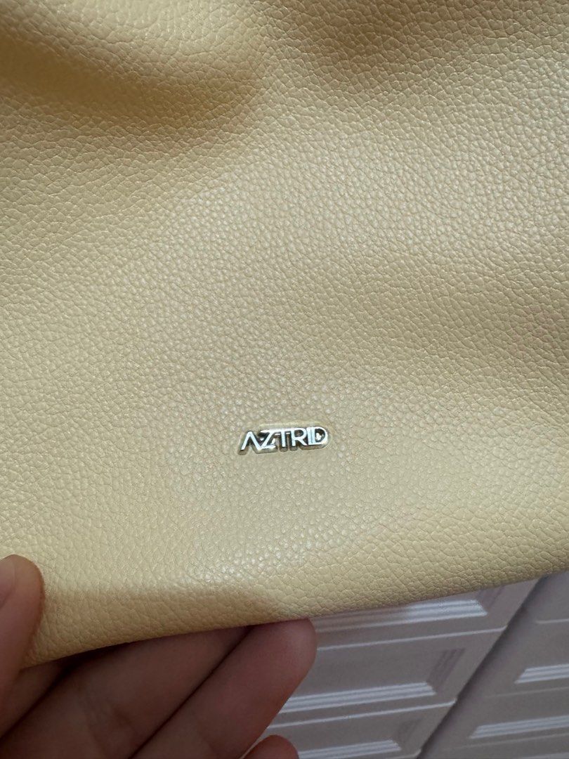 Aztrid Small Hobo bag (Category: Shoulder Bags) located in Tagaytay City. Submitted by leylamm (Listing ID 1410544783, Image 2). Description: Yellow (Buttermilk). Bought for the year-end party, used once only. No major issue. Selling to support my rescued cats..