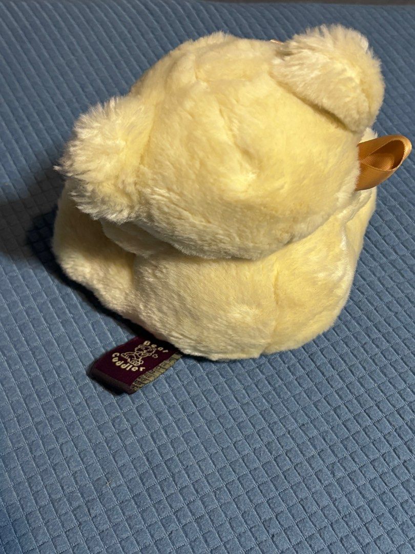 Bear Cuddler Teddy Bear with Pillow (Category: Plushies & Soft Toys) located in Quezon City. Submitted by _rronnie (Listing ID 1410534325, Image 3). Description: - Adorable Bear Cuddie teddy bear - Features light yellow fur and a brown bow.