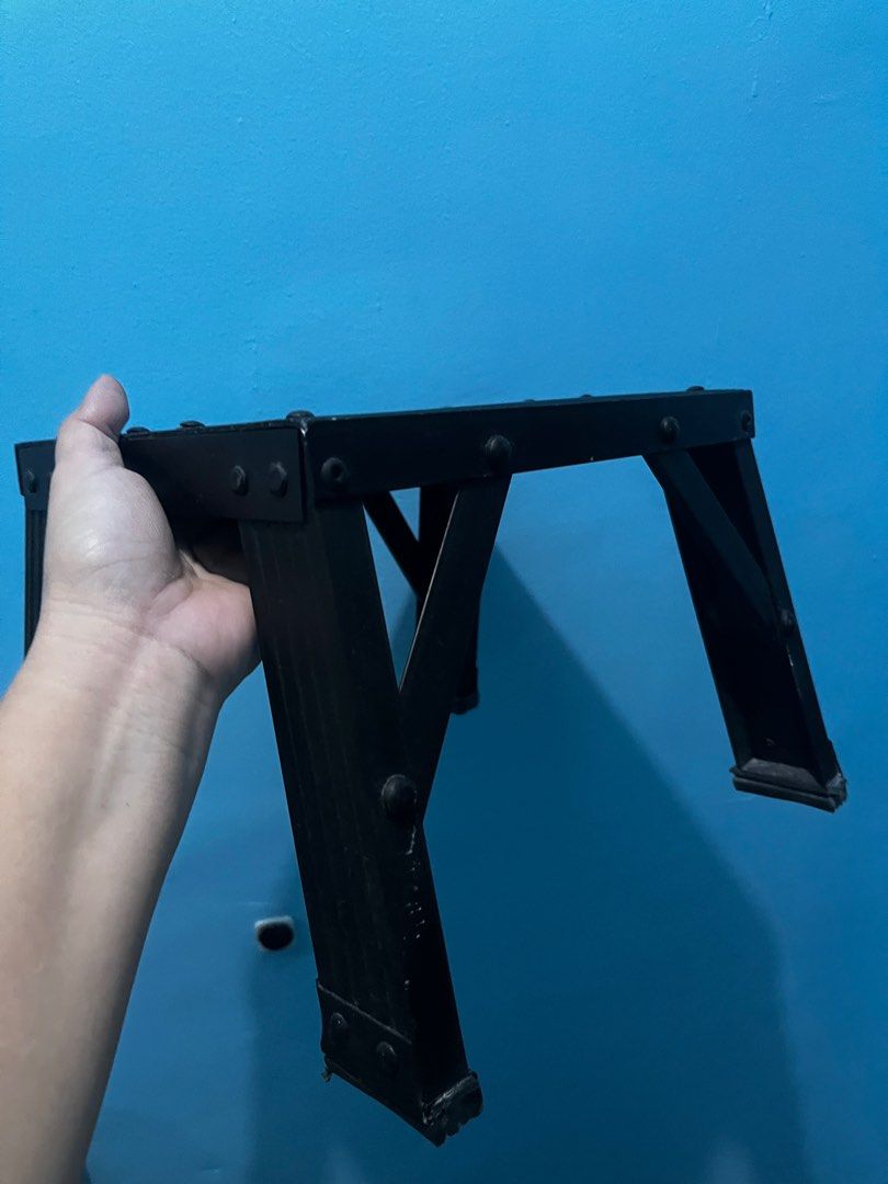 Black Metal Step Stool (Category: Chairs) located in Pasay City. Submitted by beye01 (Listing ID 1410540204, Image 3). Description: - Black metal step stool - Rectangular top with angled legs for stability - Dimensions: Approximately L25cm x W21cm x H20cm .