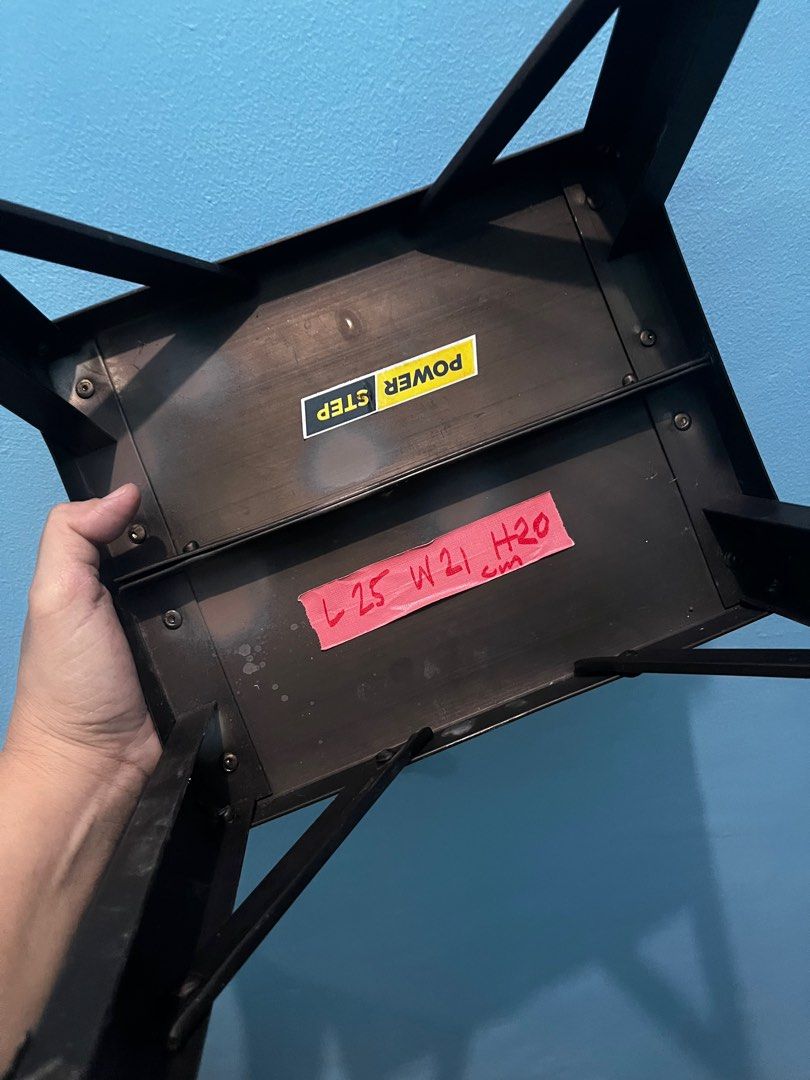 Black Metal Step Stool (Category: Chairs) located in Pasay City. Submitted by beye01 (Listing ID 1410540204, Image 2). Description: - Black metal step stool - Rectangular top with angled legs for stability - Dimensions: Approximately L25cm x W21cm x H20cm .