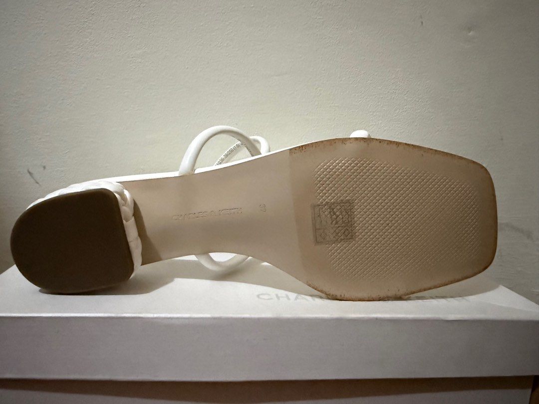 Charles & Keith Double-Strap Braided-Heel Mules - White (Category: Heels) located in Muntinlupa City. Submitted by anneyways (Listing ID 1410420513, Image 3). Description: - Charles & Keith mules - White color - Size 39 - Double-strap design - Braided heel detail - Open toe - Comes with original box - Style code: CK1-60051036 Bought in Singapore. Never used..
