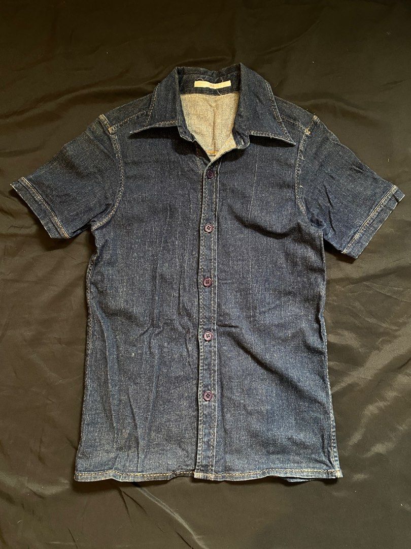 Denim Short Sleeve Shirt (Category: Shirts) located in Malabon City. Submitted by declutteredbycole (Listing ID 1410384346, Image 1). Description: orange stitching good condition fits small, women's dark blue denim in actual issue: small stain at the back.