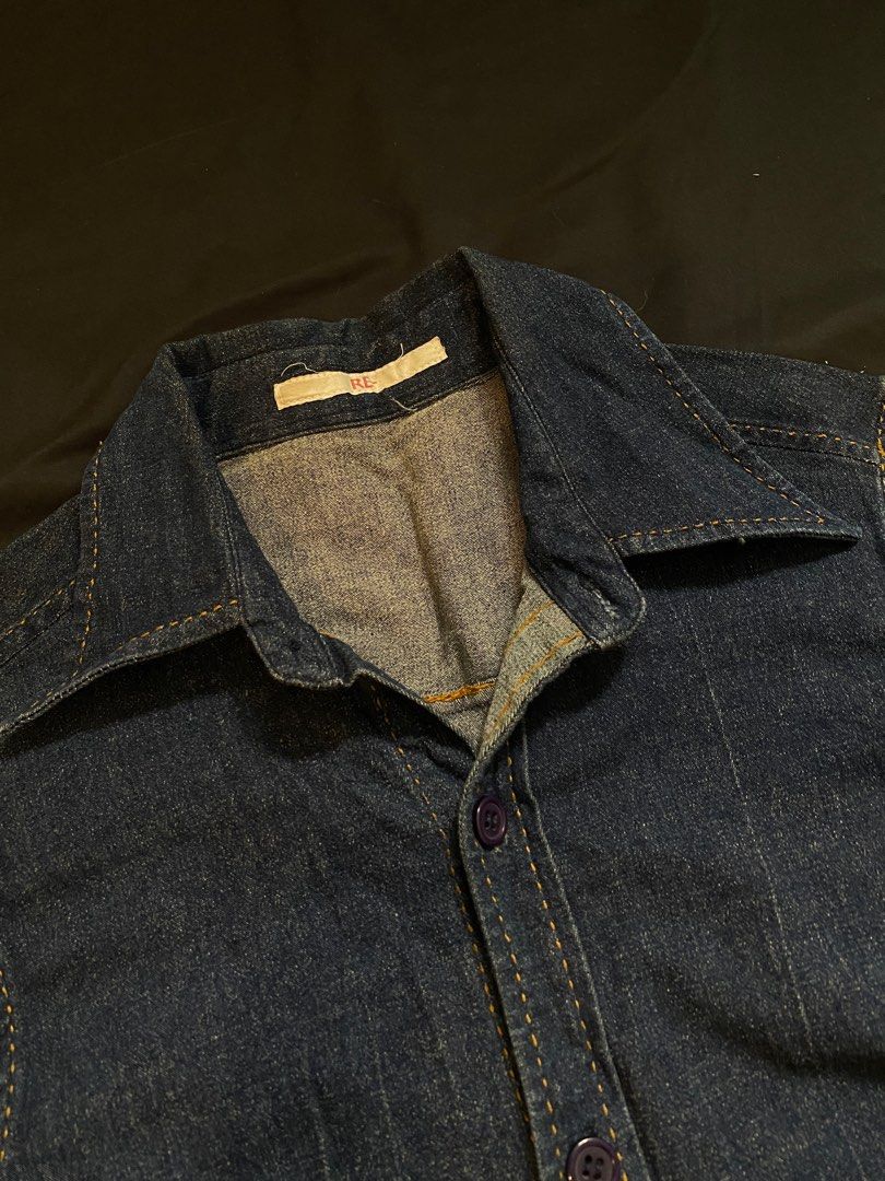 Denim Short Sleeve Shirt (Category: Shirts) located in Malabon City. Submitted by declutteredbycole (Listing ID 1410384346, Image 3). Description: orange stitching good condition fits small, women's dark blue denim in actual issue: small stain at the back.