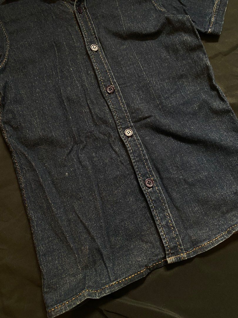 Denim Short Sleeve Shirt (Category: Shirts) located in Malabon City. Submitted by declutteredbycole (Listing ID 1410384346, Image 2). Description: orange stitching good condition fits small, women's dark blue denim in actual issue: small stain at the back.
