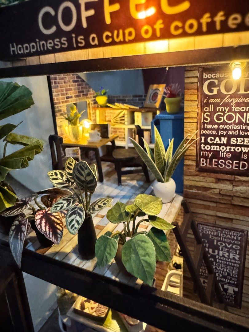 DIY Miniature Coffee Shop with Lights (Category: Kids Toys) located in Manila. Submitted by judeo. (Listing ID 1410482670, Image 3). Description: Already built miniature!❤️ - With cover - DIY miniature coffee shop - Two-story design - Includes tiny furniture, plants, and food displays - Features LED lights - Perfect for display or as a gift - battery not included.