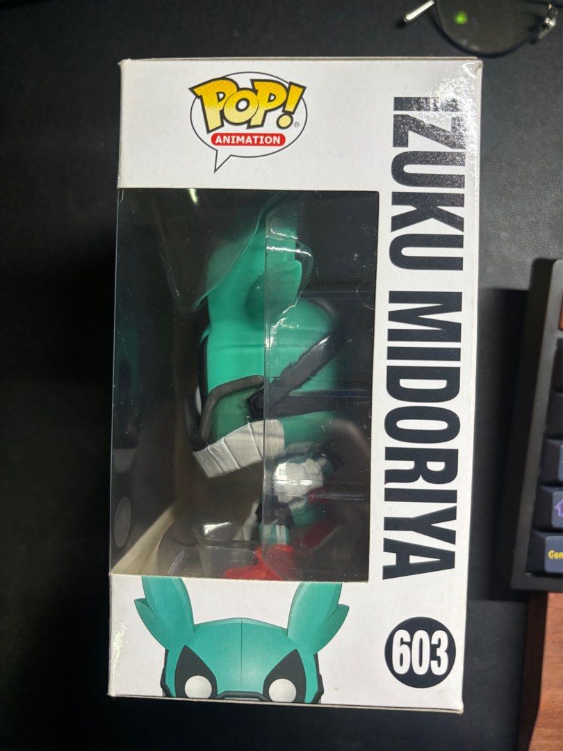Funko Pop Izuku Midoriya #603 (Category: Designer & Blind Box Toys) located in Marikina City. Submitted by sanj1 (Listing ID 1410447284, Image 2). Description: - Preloved but in good condition - BIB (Back in box) nilabas sa box for display - Funko Pop My Hero Academia - Izuku Midoriya Location: Marikina City Shipping fee will be shouldered by the buyer.