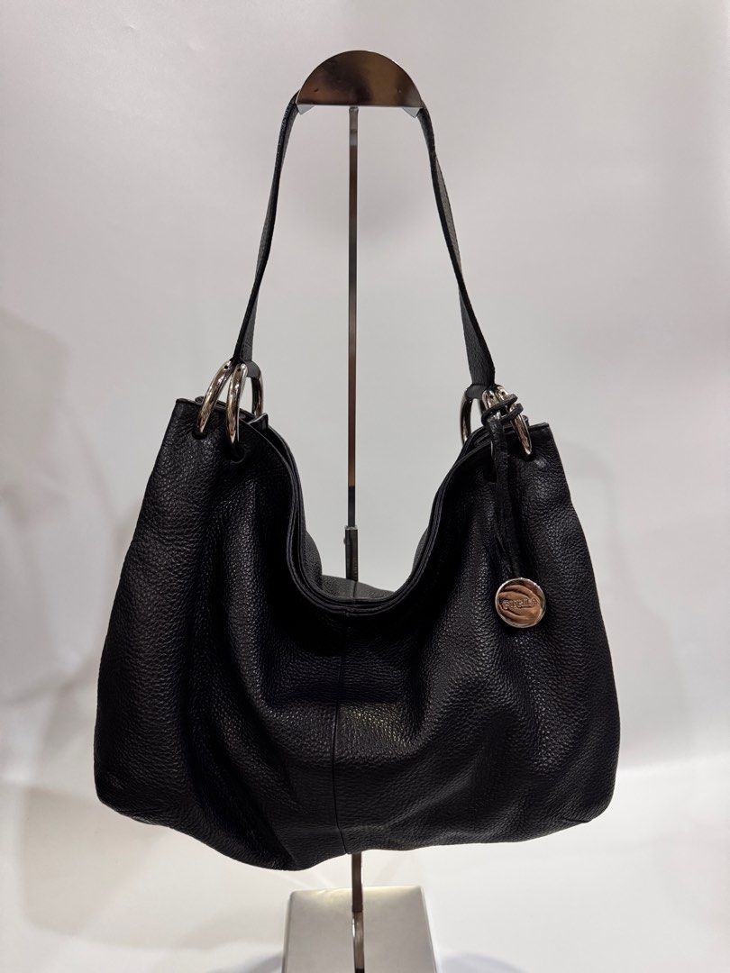 Furla Black Leather Hobo Bag (Category: Luxury Bags & Wallets) located in Davao. Submitted by stellietas (Listing ID 1410535652, Image 1). Description: Size: 14L x 10H x 5.5W inches No flaws, Excellent condition, with signs of use minimal on the rubber linning of the edges part of the handle. Black Genuine leather. Clean interior. Bet❤️❤️.