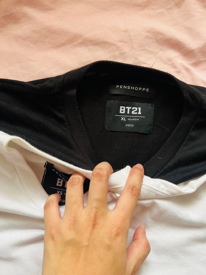 Penshoppe BT21 T-shirts (Category: Shirts) located in Rizal. Submitted by bubbles_1313 (Listing ID 1410415099, Image 3). Description: rfs: DECLUTTERING!! - BUNDLE BT21 t-shirts from Penshoppe - white shirt is size XS. (has some small stains, shown in the pics) - black shirt is size XL..