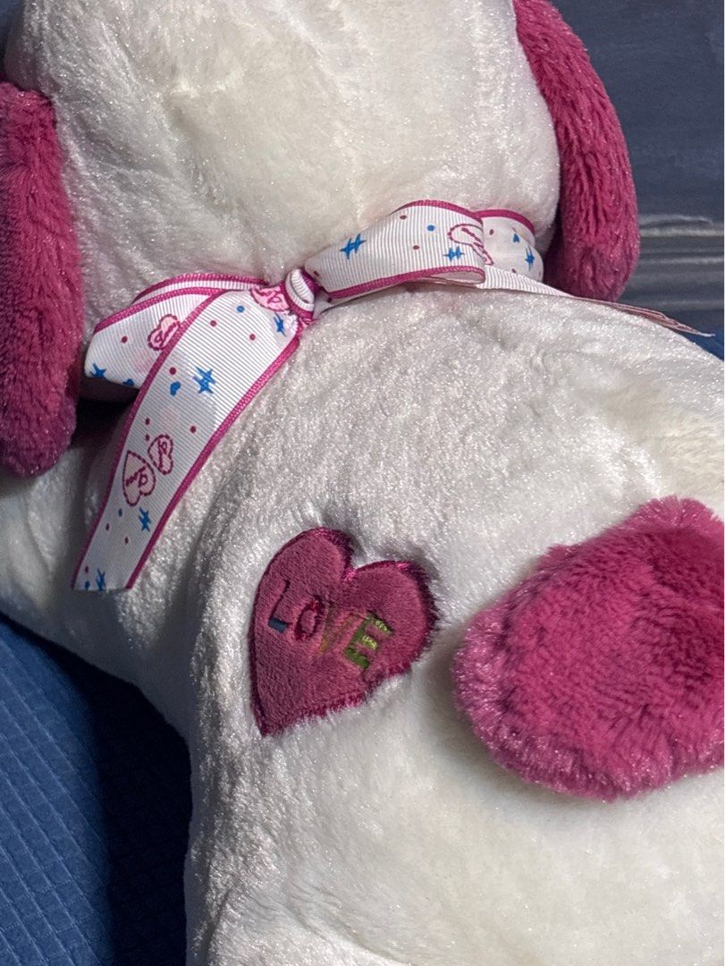 Pink & White Dog Plush Toy (Category: Plushies & Soft Toys) located in Quezon City. Submitted by _rronnie (Listing ID 1410532517, Image 3). Description: - Made by Gift Factory - Pink & White Dog Plush Toy - Features pink ears and heart details.