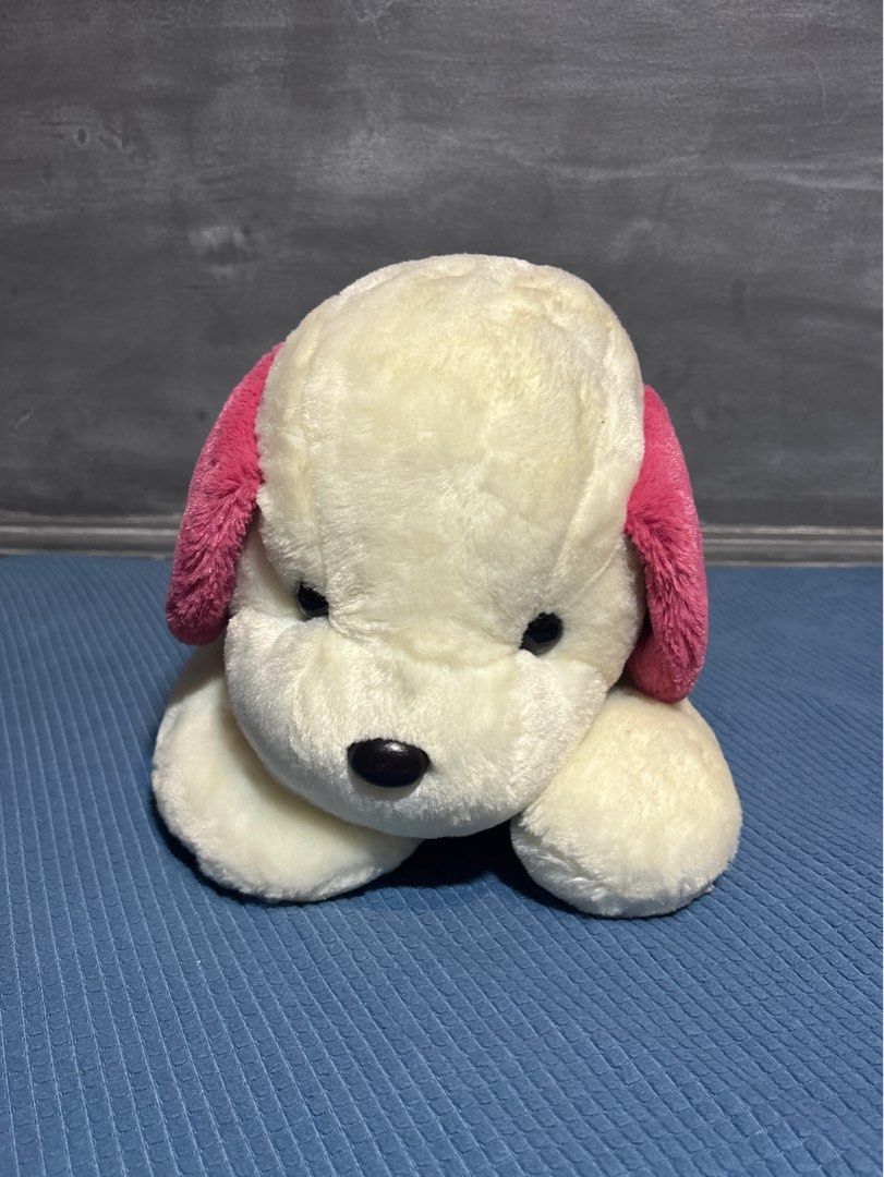 Pink & White Dog Plush Toy (Category: Plushies & Soft Toys) located in Quezon City. Submitted by _rronnie (Listing ID 1410532517, Image 1). Description: - Made by Gift Factory - Pink & White Dog Plush Toy - Features pink ears and heart details.