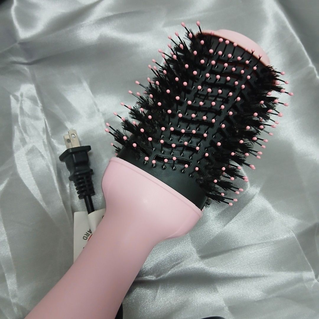 Pink Hair Dryer Brush (Category: Hair) located in Quezon City. Submitted by marceline_am (Listing ID 1410479414, Image 3). Description: - HODEKT hair dryer brush - Pink body - Round brush head - Heat settings: High, Middle, Low, Off - Black bristles with pink tips - Includes power cord.