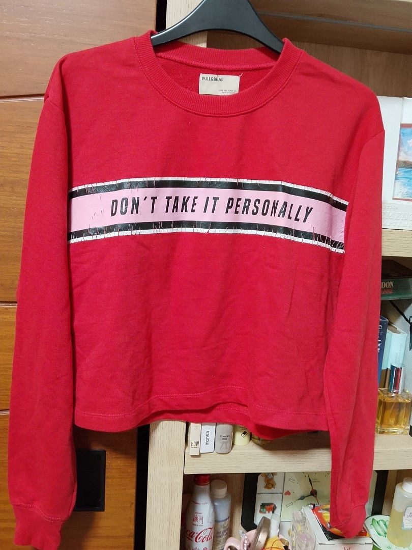 Pull&Bear Red Sweatshirt - Don't Take It Personally (Category: Coats, Jackets and Outerwear) located in Quezon City. Submitted by ahn-ne (Listing ID 1410475368, Image 1). Description: - Pull&Bear sweatshirt - Red color - Features the phrase "DON'T TAKE IT PERSONALLY" - Cropped style - Crew neck - Long sleeves - Casual wear.