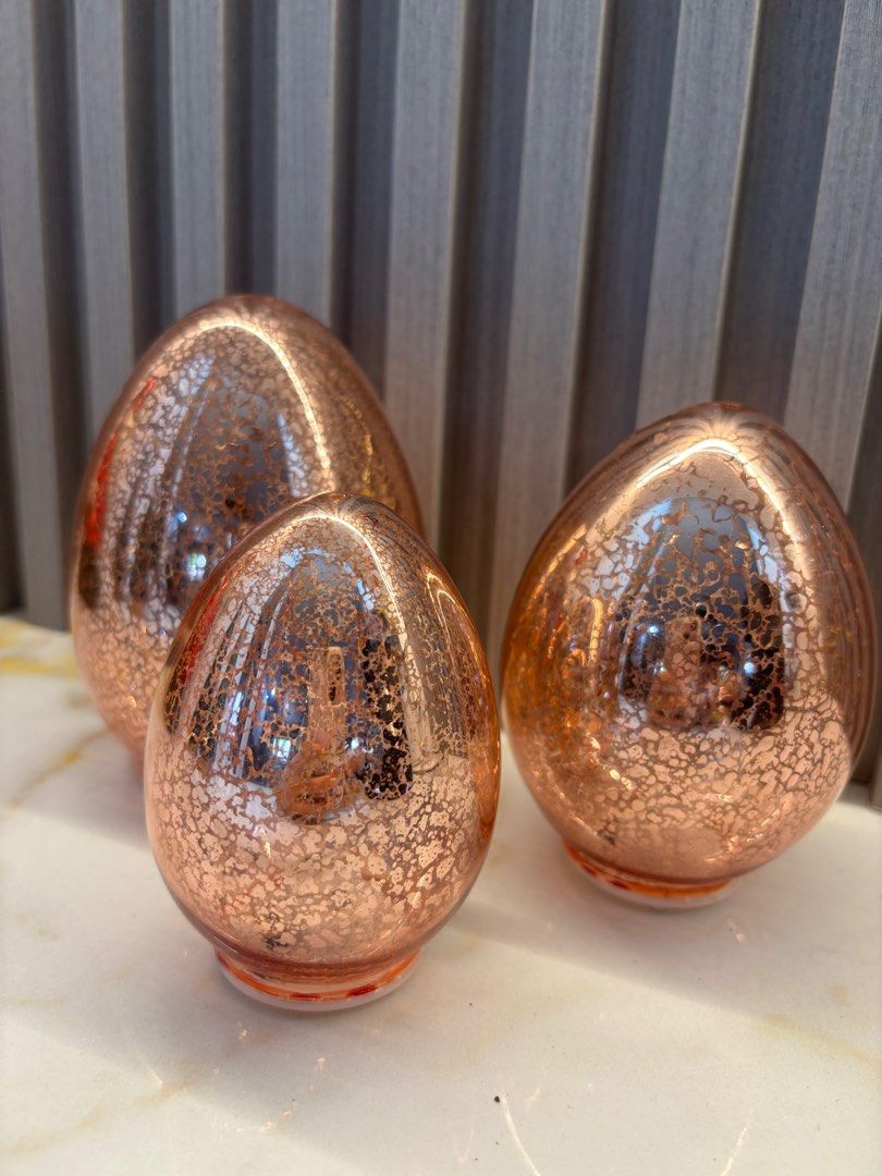 Rose Gold Crackle Glass Egg Set (Category: Other Home Decor) located in Cavite. Submitted by ejp3773 (Listing ID 1410419008, Image 2). Description: - Set of three decorative eggs - Rose gold crackle glass finish - Glossy appearance - Unique textured surface - Ideal for shelves, tables, or decorative arrangements - Adds a touch of elegance.