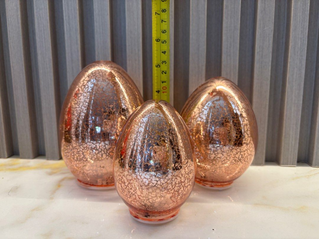 Rose Gold Crackle Glass Egg Set (Category: Other Home Decor) located in Cavite. Submitted by ejp3773 (Listing ID 1410419008, Image 3). Description: - Set of three decorative eggs - Rose gold crackle glass finish - Glossy appearance - Unique textured surface - Ideal for shelves, tables, or decorative arrangements - Adds a touch of elegance.