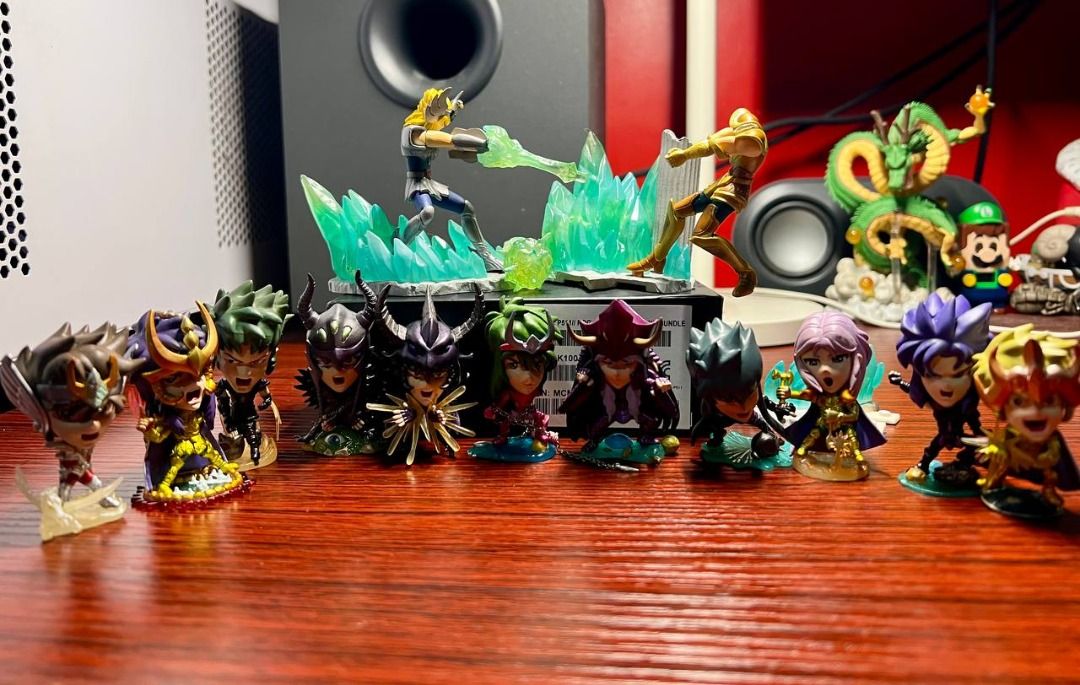 Saint Seiya Mini Figures Set (Category: Figurines & Statues) located in Baguio. Submitted by ditoyzb08176 (Listing ID 1410505160, Image 1). Description: - Saint Seiya Mini Figure Set - Includes multiple characters - Detailed poses and special effects - Features a battle scene with crystal formations - Displayed on a wooden surface -WSIWYG -Location: Baguio City Shipping: J&T/FLASH/LBC.