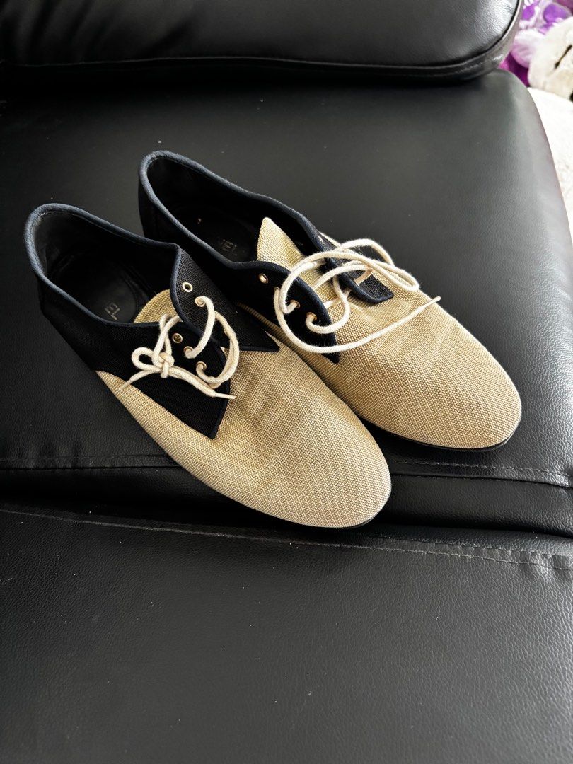 Sale!!!Authentic chanel shoes (Category: Sneakers & Footwear) located in Paranaque City. Submitted by dheng07 (Listing ID 1410381300, Image 2). Description: - Authentic Chanel lace-up shoes - Two-tone design: beige and black - Features Chanel logo - Size: 38.5C - Made in Italy - Quilted insole with Chanel logo - Includes original laces.