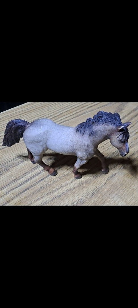 Schleich Horse Figure (Category: Figurines & Statues) located in Davao. Submitted by bravemoon_556cd5 (Listing ID 1410377554, Image 1). Description: - Schleich horse figure - Grey body - Dark mane and tail - Running pose - Features Schleich logo and '69' marking - Made in China.