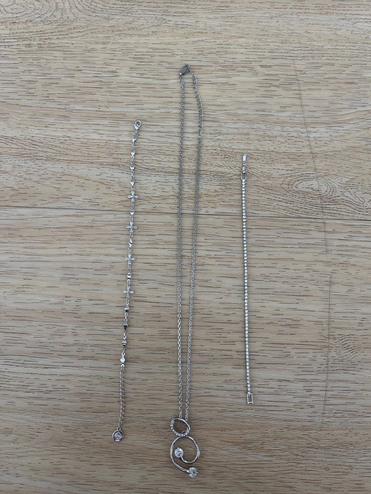 Silver bracelets (Category: Bracelets) located in Singapore. Submitted by brightfire_09ad67 (Listing ID 1410399863, Image 1). Description: Silver bracelets used only once. Still in mint condition. $20 for both, Will throw in the necklace for free (chain needs a bit of polishing) Price negotiable for fast deal at my convenience.