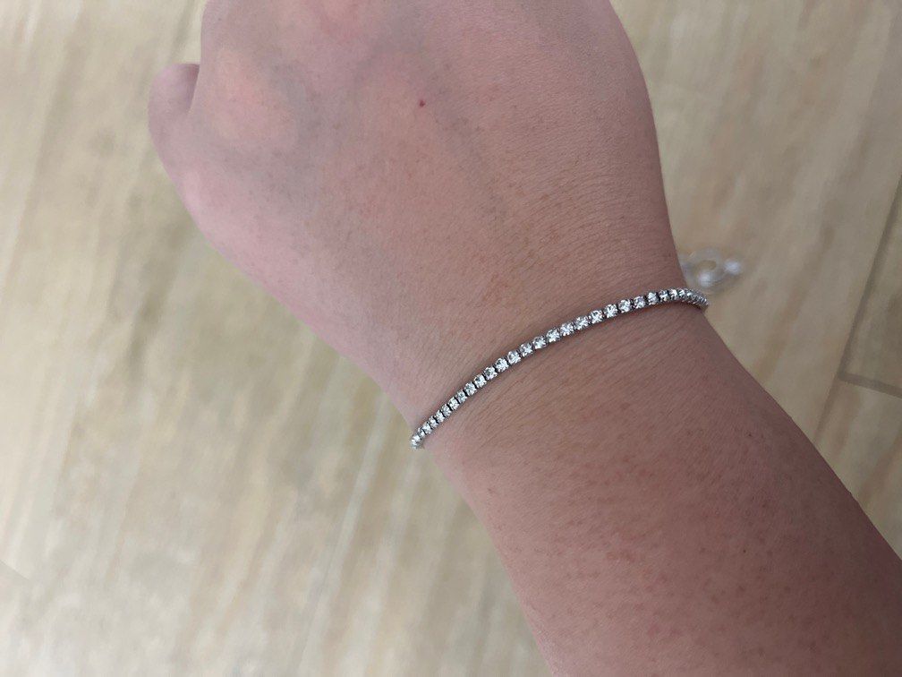 Silver bracelets (Category: Bracelets) located in Singapore. Submitted by brightfire_09ad67 (Listing ID 1410399863, Image 3). Description: Silver bracelets used only once. Still in mint condition. $20 for both, Will throw in the necklace for free (chain needs a bit of polishing) Price negotiable for fast deal at my convenience.