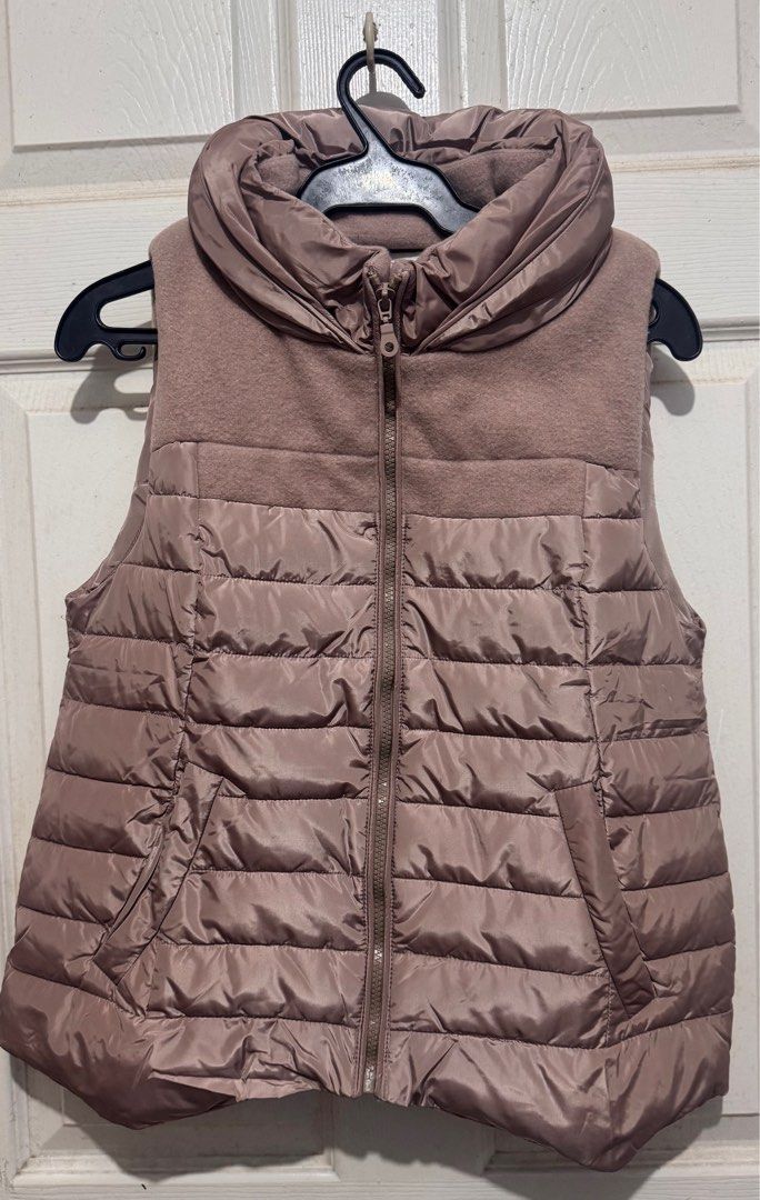 Taupe Puffer Vest (Category: Coats, Jackets and Outerwear) located in Quezon City. Submitted by chamibee (Listing ID 1410468092, Image 1). Description: - Taupe Puffer Vest - Size: S - Stylish design - Perfect for layering.