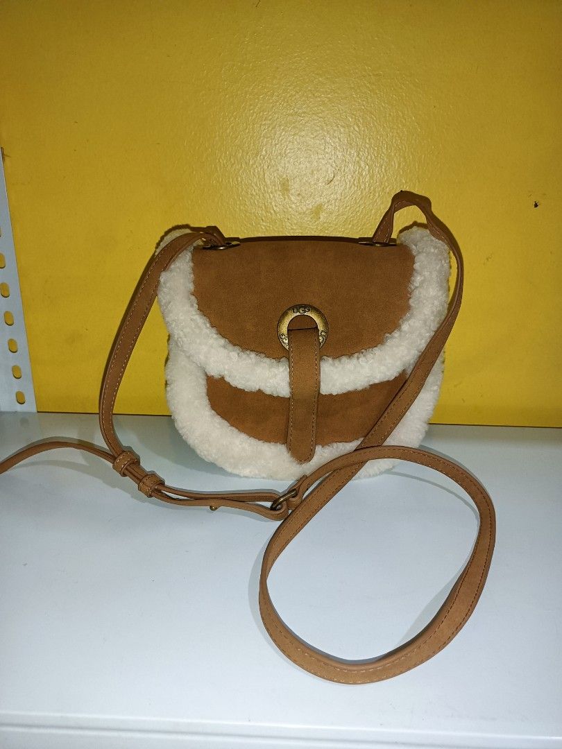UGG Heritage Suede Crossbody Bag (Category: Cross-body Bags) located in Bolinao. Submitted by shayne_0215 (Listing ID 1410525265, Image 1). Description: Slightly Negotiable No Flaws Only needs cleaning on the inside lining MOP: GCASH.