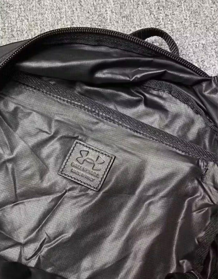 Under Armour Balenciaga Backpack (Category: Luxury Bags & Wallets) located in Calamba. Submitted by apppp_117 (Listing ID 1410545994, Image 3). Description: - Black backpack with Under Armour and Balenciaga logos. - Front zippered pocket. - Top handle. - Adjustable shoulder straps. - Main compartment. - Interior label: "Under Armour" and "Made in Italy". i cant provide more pics the shipping is about 10-17 days so please be patient thank you!!.