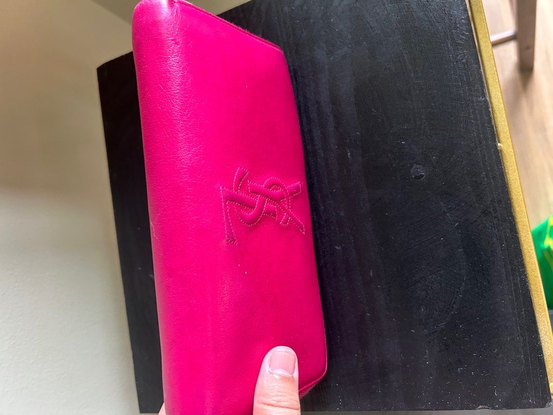 YSL dark pink wallet (Category: Luxury Bags & Wallets) located in Makati City. Submitted by ajoloso_69 (Listing ID 1410491970, Image 3). Description: .
