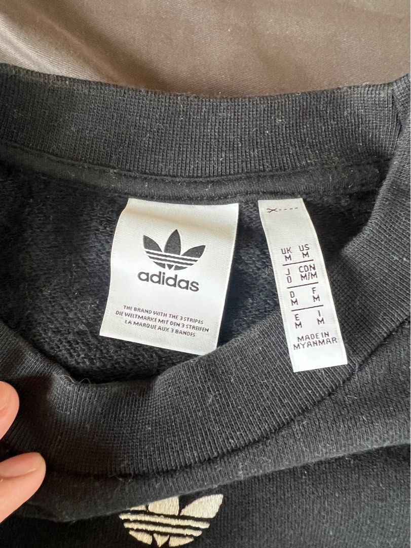 Adidas Black Sweatshirt with Stripes (Category: Longsleeves) located in Mandaluyong City. Submitted by minimalmeowguy (Listing ID 1410567093, Image 2). Description: - Adidas sweatshirt - Black with white stripes - Adidas logo on chest - Size: M - Made in Myanmar - Details are in the photos.