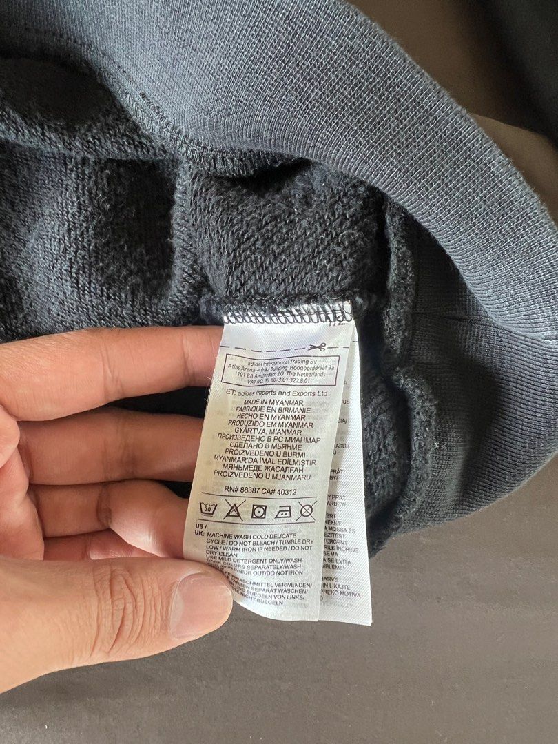 Adidas Black Sweatshirt with Stripes (Category: Longsleeves) located in Mandaluyong City. Submitted by minimalmeowguy (Listing ID 1410567093, Image 3). Description: - Adidas sweatshirt - Black with white stripes - Adidas logo on chest - Size: M - Made in Myanmar - Details are in the photos.