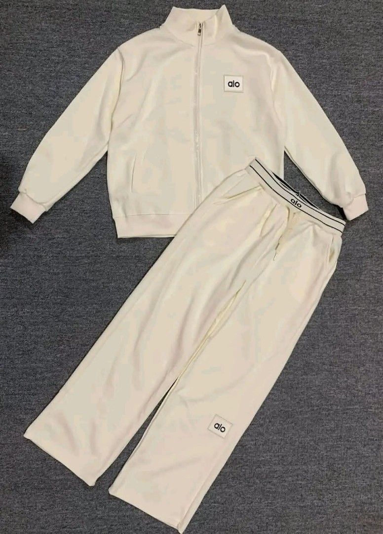 Alo Yoga Tracksuit Set (Category: Activewear) located in Manila. Submitted by raredeer-4deb4e (Listing ID 1410571356, Image 2). Description: - Alo Yoga tracksuit set - Includes zip-up jacket and matching pants - Features Alo logo - Pants with drawstring waist and contrasting waistband - Available colors: Black, Cream, Burgundy, Grey - Ideal for workouts and casual wear.