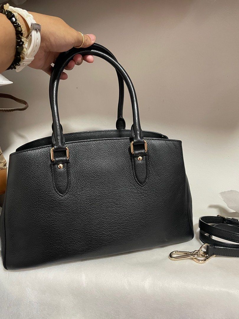 Authentic Coach Margot Carryall Black Leather Handbag (Category: Luxury Bags & Wallets) located in Guiguinto. Submitted by prelovedinc2024 (Listing ID 1410557296, Image 3). Description: guaranteed authentic, bought in Japan with signs of use - magnetic closure is weak, scratches on hardwares no rubs pebbled leather 3compartment last photo is only for reference size: approx 13x9x5”.