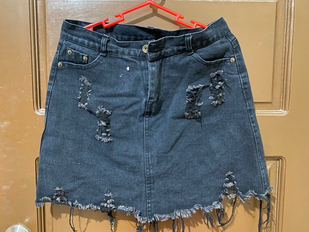 Black Denim Distressed Skirt (Category: Skirts) located in Manila. Submitted by lachicahermosa (Listing ID 1410579757, Image 1). Description: - Black denim mini skirt - Distressed detailing - Button and zipper closure - Front and back pockets - Frayed hem - Classic five-pocket design - Mini length.