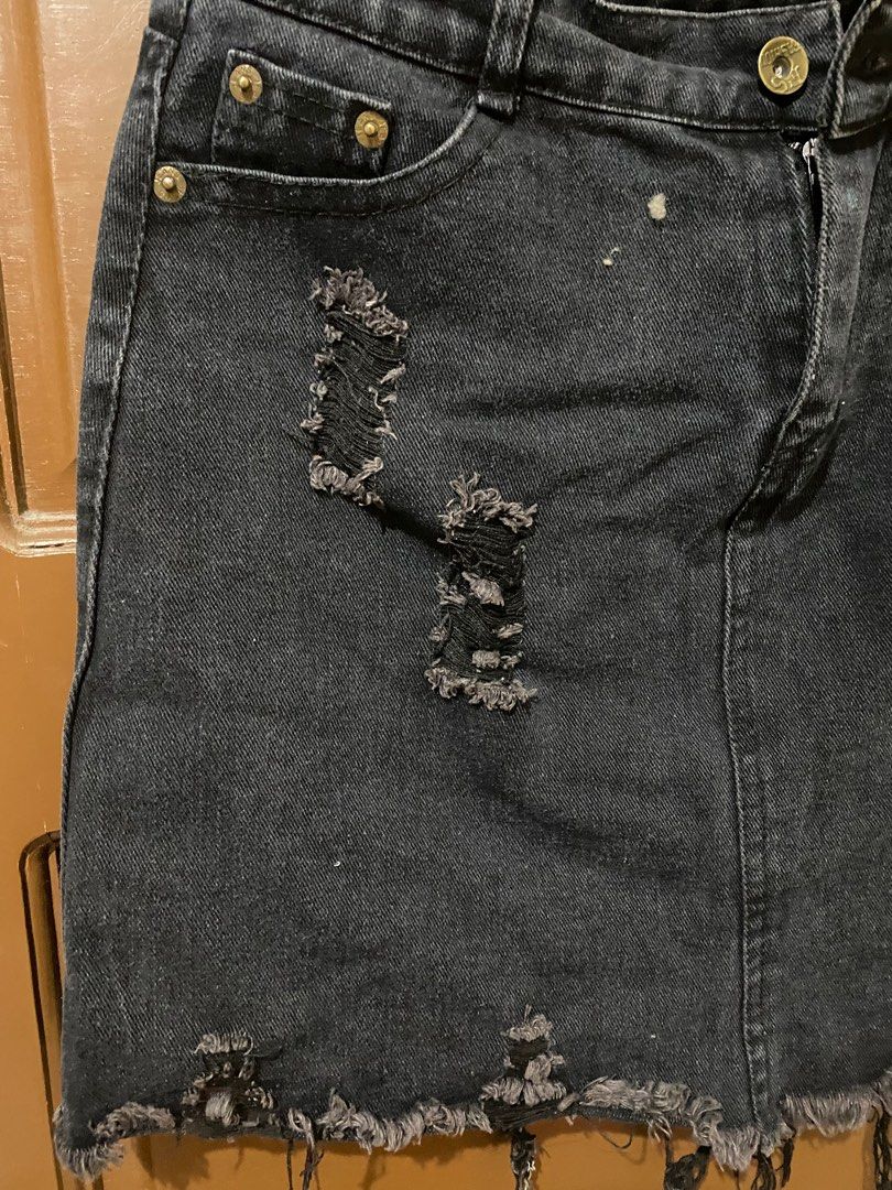Black Denim Distressed Skirt (Category: Skirts) located in Manila. Submitted by lachicahermosa (Listing ID 1410579757, Image 3). Description: - Black denim mini skirt - Distressed detailing - Button and zipper closure - Front and back pockets - Frayed hem - Classic five-pocket design - Mini length.