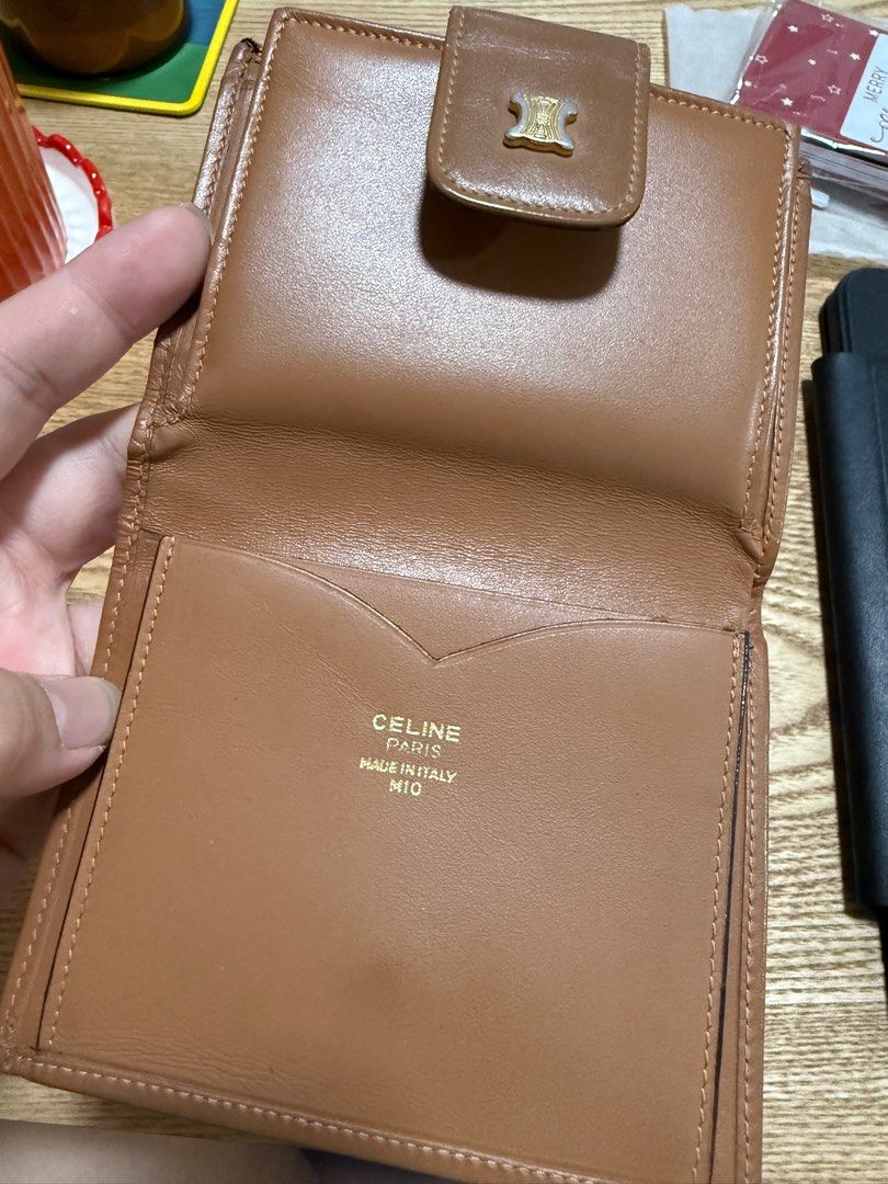 Celine Triomphe Wallet (Category: Luxury Bags & Wallets) located in Taguig. Submitted by janina8712 (Listing ID 1410669245, Image 3). Description: - Celine Triomphe wallet in brown - Features the iconic Triomphe pattern - Snap closure - Includes a coin purse - Multiple card slots and bill compartment - No stickiness on the coin purse and compartment - Made in Italy Flaws - faded hardware - minimal scratches on the side leather ✨Payment first, bef