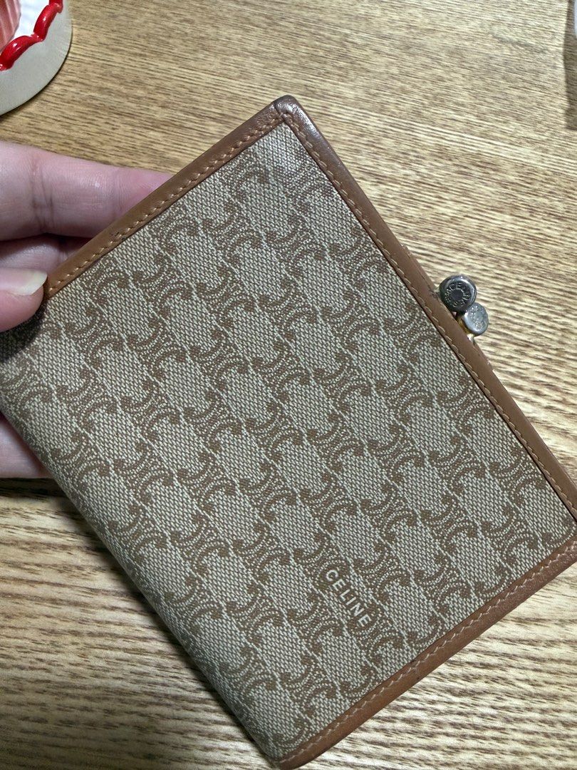 Celine Triomphe Wallet (Category: Luxury Bags & Wallets) located in Taguig. Submitted by janina8712 (Listing ID 1410669245, Image 2). Description: - Celine Triomphe wallet in brown - Features the iconic Triomphe pattern - Snap closure - Includes a coin purse - Multiple card slots and bill compartment - No stickiness on the coin purse and compartment - Made in Italy Flaws - faded hardware - minimal scratches on the side leather ✨Payment first, bef