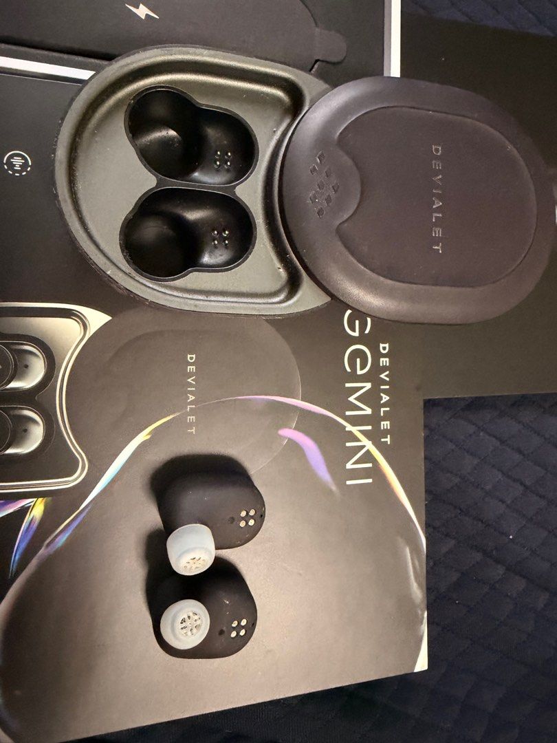 Devialet Gemini (Category: Earphones) located in Singapore. Submitted by twikz23 (Listing ID 1410607909, Image 7). Description: The Devialet Gemini 1 (or original Gemini) is a premium set of true wireless earbuds known for bringing Devialet’s acclaimed audio engineering into a portable format, featuring strong Active Noise Cancellation (ANC), Ear Active Matching (EAM) for personalized sound, IPX4 water resistance, aptX codec support, and a comfor