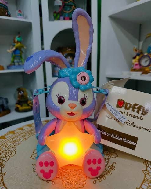 Disney Shanghai Resort StellaLou Bubble Machine (Category: Kids Toys) located in Pasig City. Submitted by royski72 (Listing ID 1410660434, Image 2). Description: - StellaLou bubble machine from Shanghai Disney Resort. - Features a star-shaped light. - Comes with a convenient strap. - Includes a bottle of bubble solution. - Suitable for children aged 3 and up. - Brand new, still in original packaging..