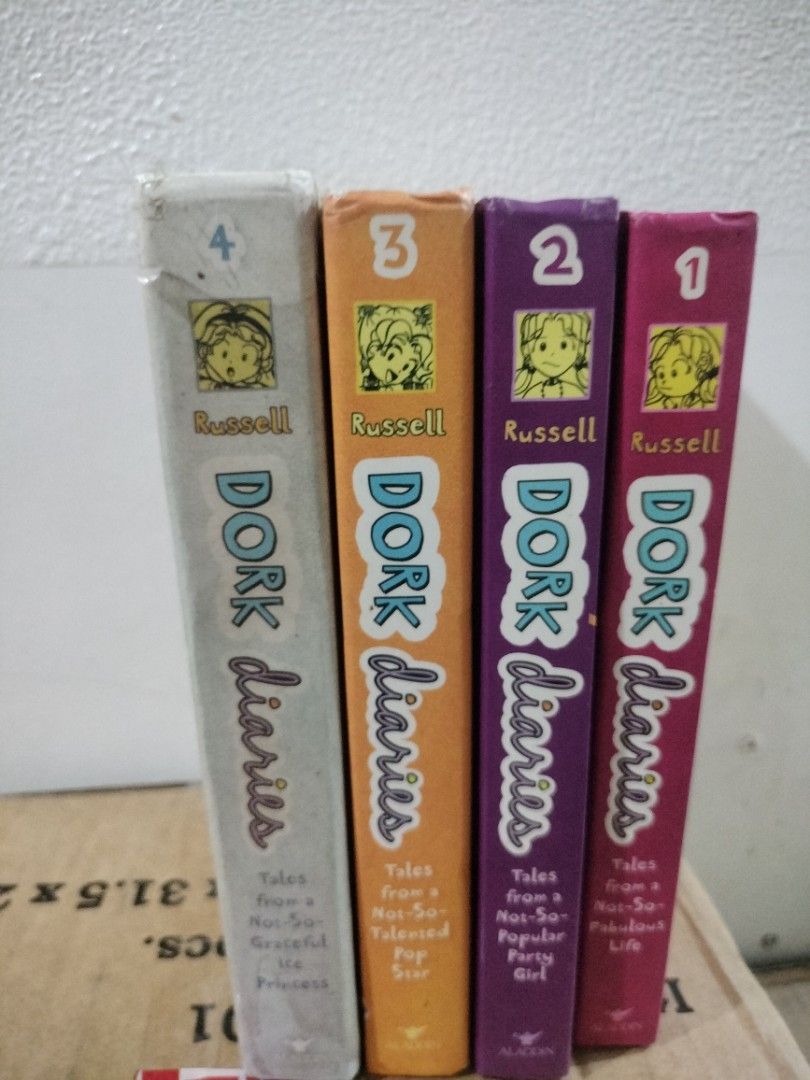 Dork Diaries Books Set HARDBOUND (Category: Children's Books) located in Manila. Submitted by chiki_chem (Listing ID 1410555056, Image 1). Description: - Dork Diaries book set (Volumes 1, 2, 3, and 4). - Features colorful spines with the Dork Diaries logo and character illustrations. - Perfect for a new reader! - Complete set..