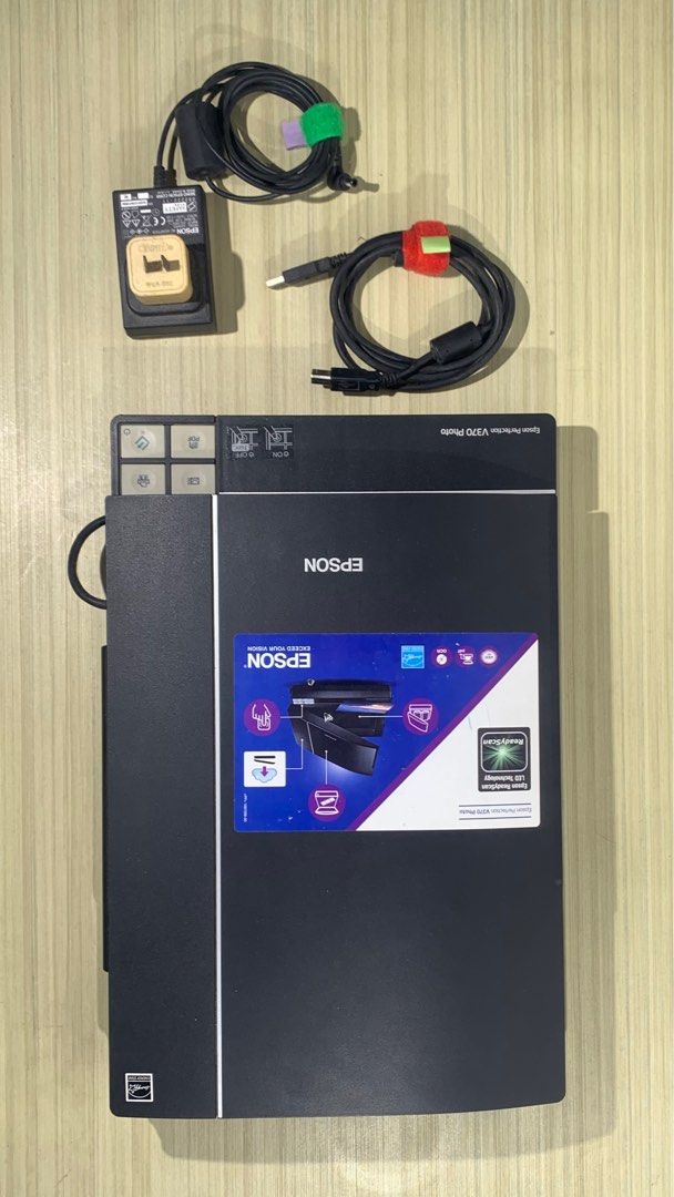 Epson Perfection V370 Photo Scanner (Category: Printers, Scanners & Copiers) located in Rizal. Submitted by AAA.PH (Listing ID 1410643097, Image 1). Description: - Epson Perfection V370 Photo Scanner - Includes power adapter and USB cable - Comes with film holder for negatives and slides - Features easy scan buttons - In good working condition.