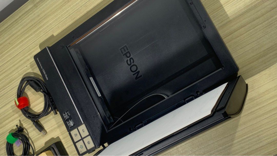 Epson Perfection V370 Photo Scanner (Category: Printers, Scanners & Copiers) located in Rizal. Submitted by AAA.PH (Listing ID 1410643097, Image 2). Description: - Epson Perfection V370 Photo Scanner - Includes power adapter and USB cable - Comes with film holder for negatives and slides - Features easy scan buttons - In good working condition.