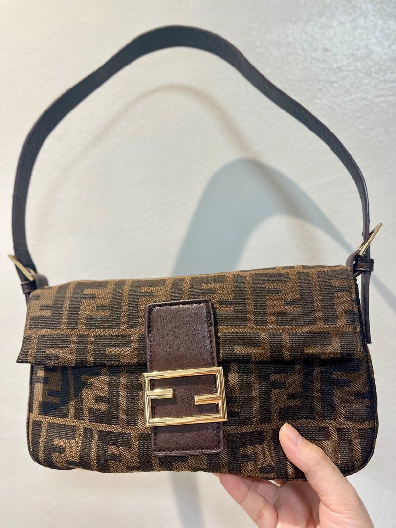 Fendi Zucca Baguette Bag (Category: Luxury Bags & Wallets) located in Manila. Submitted by seagypseaph (Listing ID 1410636898, Image 1). Description: 20% OFF! Happening from May 18-25! OG Price: Php6,200 Fendi vintage Zucca baguette bag Rank A-AB (lightly used with light visible marks) (not guaranteed auth) Condition: The overall bag looks like brand new but the strap has visible signs of use/peeling. Comes with a generic dustbag. You may opt to 