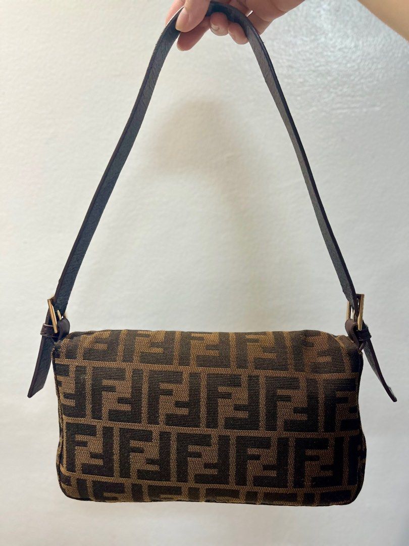 Fendi Zucca Baguette Bag (Category: Luxury Bags & Wallets) located in Manila. Submitted by seagypseaph (Listing ID 1410636898, Image 3). Description: 20% OFF! Happening from May 18-25! OG Price: Php6,200 Fendi vintage Zucca baguette bag Rank A-AB (lightly used with light visible marks) (not guaranteed auth) Condition: The overall bag looks like brand new but the strap has visible signs of use/peeling. Comes with a generic dustbag. You may opt to 