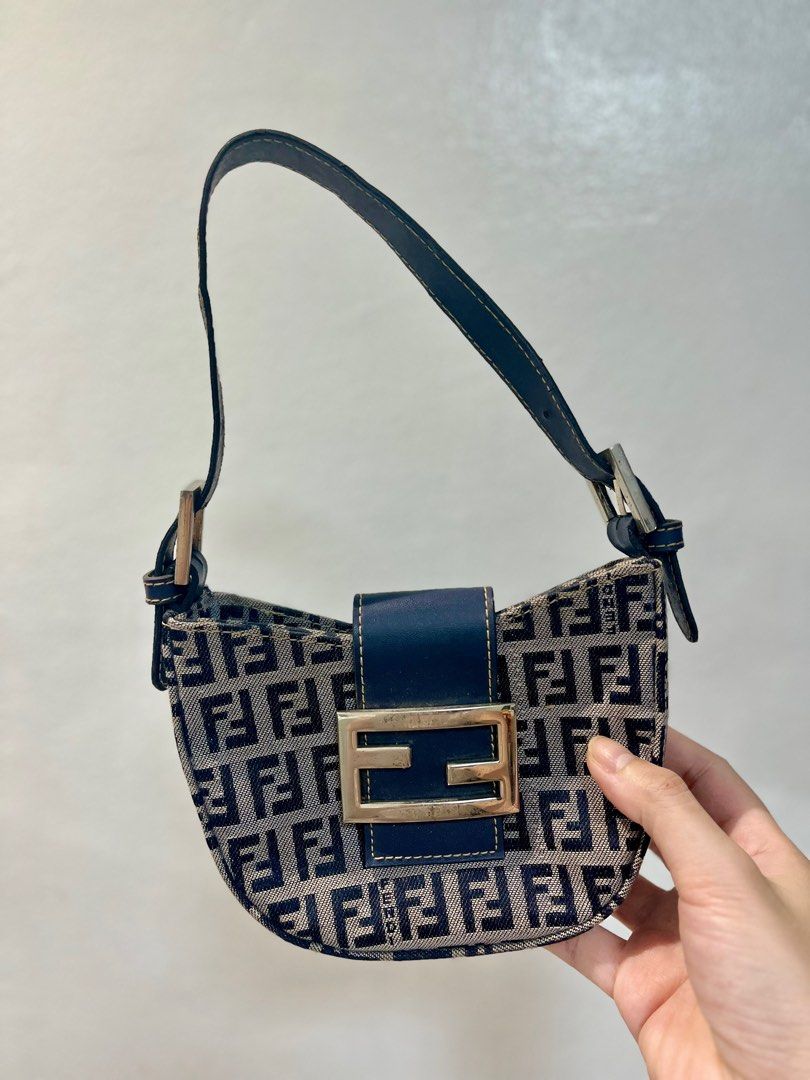 Fendi Zucca Mini FF Plaque (Croissant) Bag (Category: Luxury Bags & Wallets) located in Manila. Submitted by seagypseaph (Listing ID 1410633675, Image 1). Description: 20% OFF! Happening from May 18-25! OG Price: Php7,200 Fendi 1990-2000s Zucca Mini FF Plaque Vintage Bag - Iconic FF logo pattern - Navy blue leather strap - Silver-toned hardware - Crescent shape with rectangular base - Nano size Price negotiable. DM me! Rank: A-AB (Very good - to 