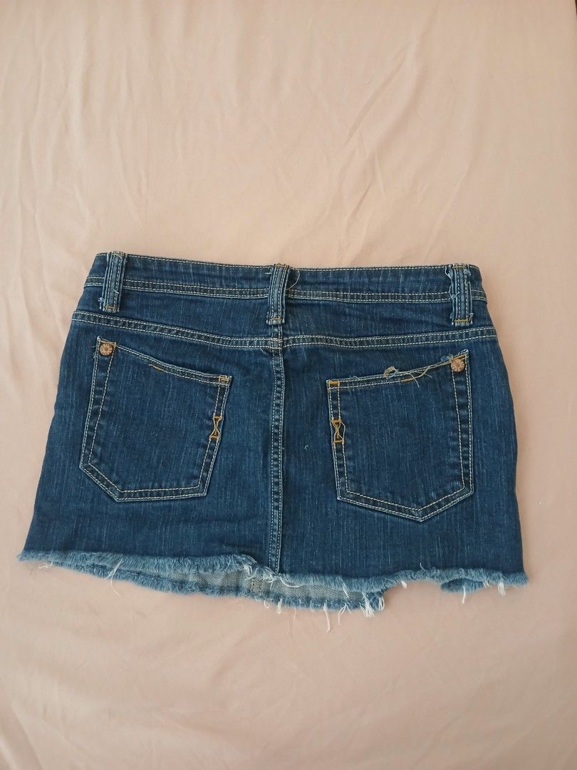 Grail Denim Mini Skirt - Size 27 (Category: Skirts) located in Paranaque City. Submitted by isimostar (Listing ID 1410675231, Image 2). Description: - Grail dark wash denim mini skirt - Size 27 - Classic five-pocket design - Raw hem - Made in USA - Material: 99% cotton, 1% spandex - Care instructions: Machine wash warm with like colors, tumble dry low, do not bleach.