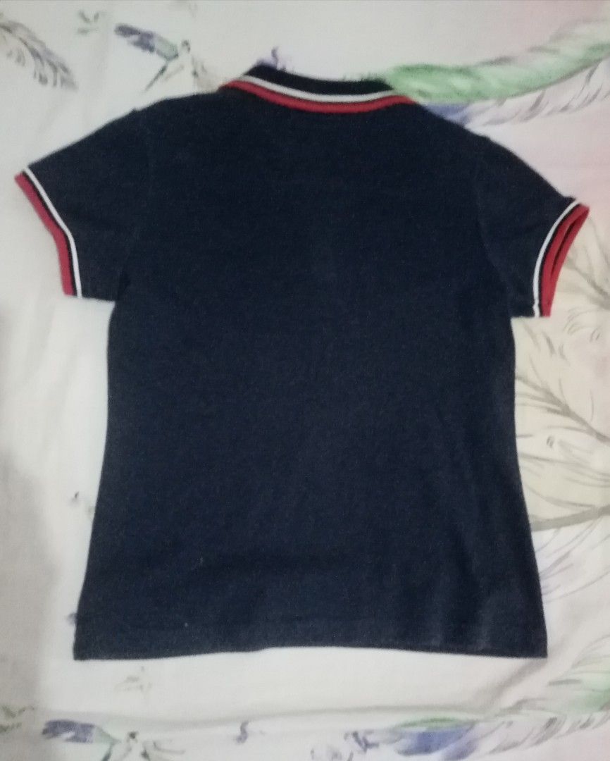 Grizzly Polo Shirt - Size 10 (Category: Babies & Kids Fashion) located in Antipolo. Submitted by cone0812 (Listing ID 1410554265, Image 2). Description: - Grizzly polo shirt - Color: Dark blue - Size: 10 Length - 19 inches Shoulder-12 inches Armpit to armpit - 13 inches.