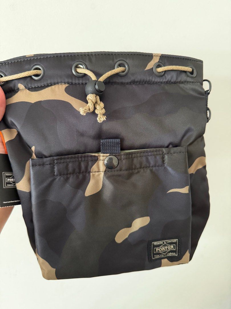 Japan 🇯🇵 limited Porter yoshida camo bucket bag (Category: Bags & Wallets) located in Singapore. Submitted by andthenublink (Listing ID 1410579547, Image 1). Description: Brand new from Japan Includes smart pac .