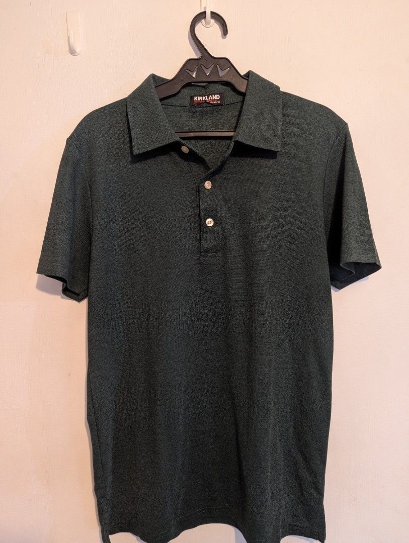 Kirkland Polo Shirt (Category: Tshirts & Polo Shirts ) located in Porac. Submitted by themightythrift (Listing ID 1410631044, Image 3). Description: - Dark green Kirkland polo shirt - Classic collar - Short sleeves - Three-button placket - Kirkland logo on collar - Breathable fabric.