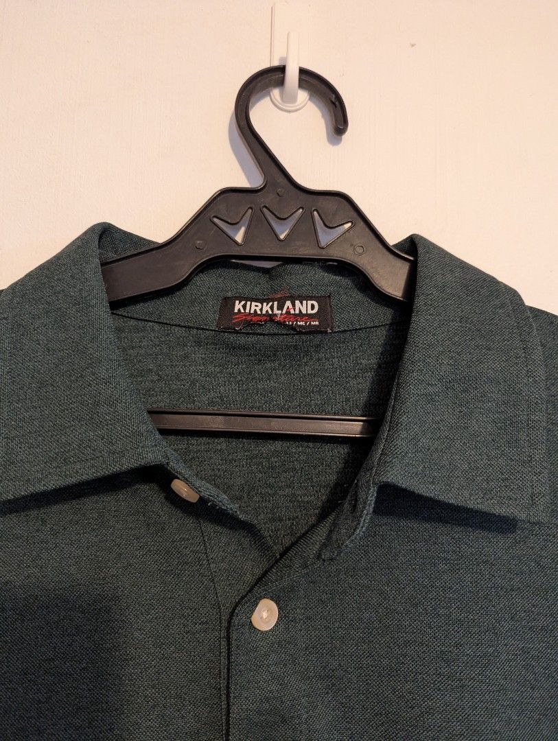 Kirkland Polo Shirt (Category: Tshirts & Polo Shirts ) located in Porac. Submitted by themightythrift (Listing ID 1410631044, Image 2). Description: - Dark green Kirkland polo shirt - Classic collar - Short sleeves - Three-button placket - Kirkland logo on collar - Breathable fabric.